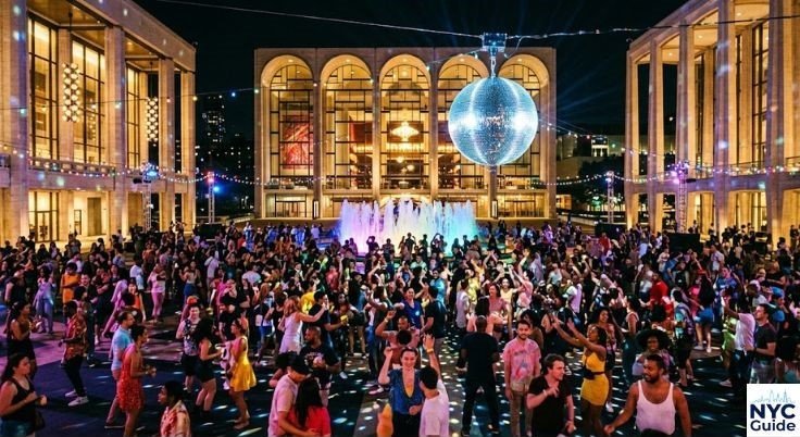 Lincoln Center Summer for the City festival crowd dancing under disco ball NYC